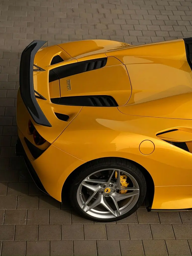 Ferrari F8 SPIDER 2023, exterior — Cannes Lux Car Rental, Cannes. Ferrari F8 SPIDER in Cannes Ferrari F8 SPIDER rental in Cannes secures a 2023 convertible…