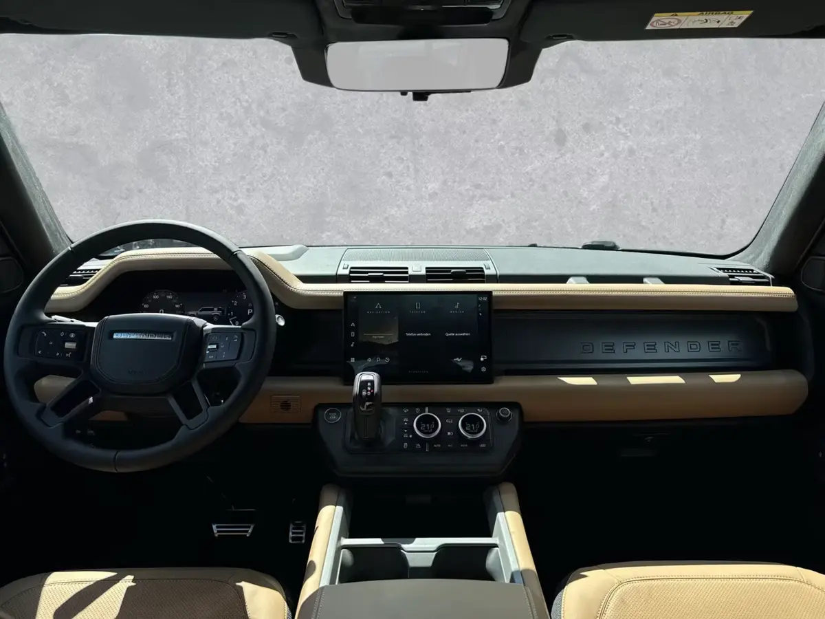 Land Rover Defender 2024, rear view — Cannes Lux Car Rental, Cannes. Land Rover Defender in Cannes Land Rover Defender hire in Cannes secures a 2024 SUV…